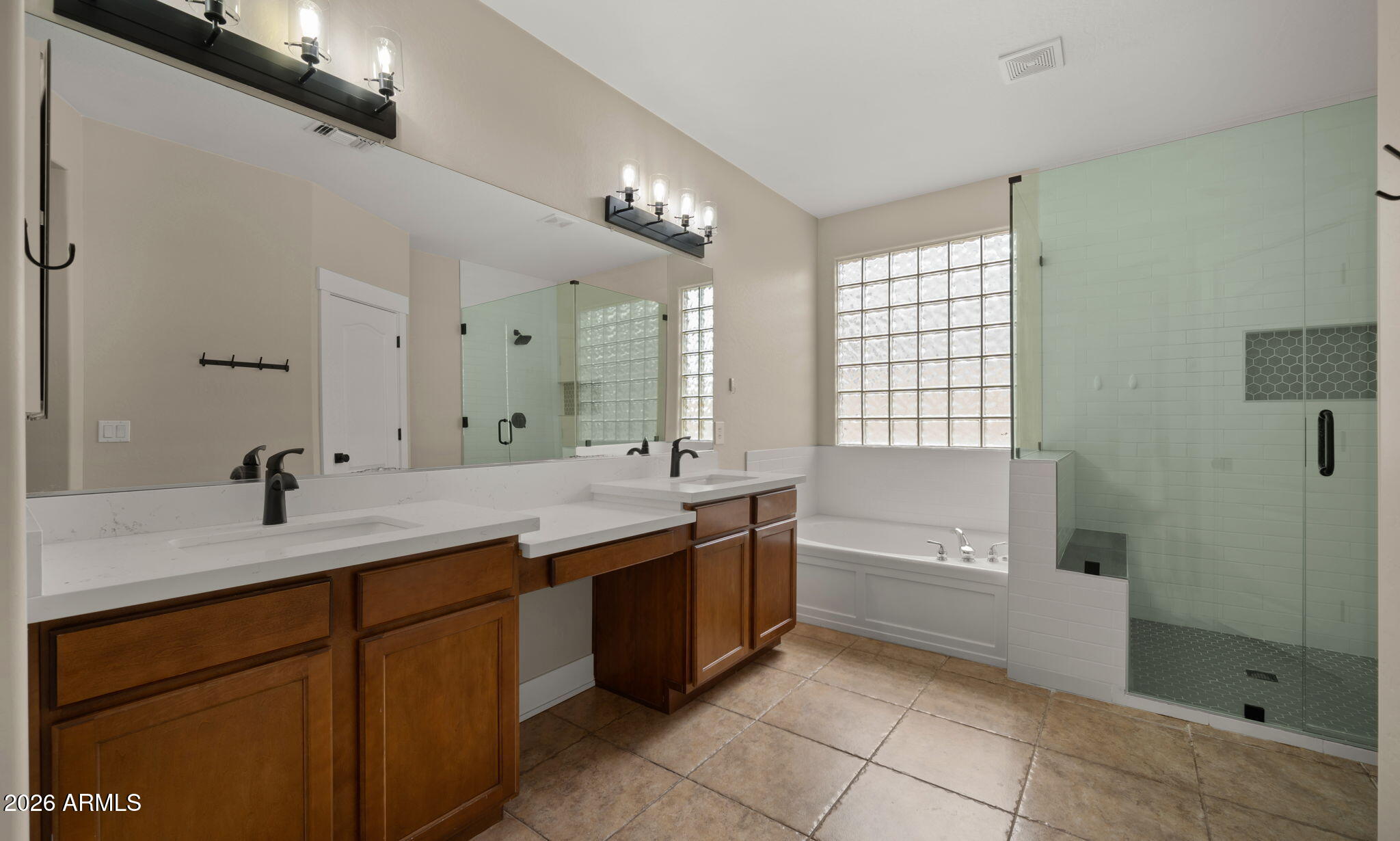 3344 East Hopkins Road Gilbert, AZ 85295 - Photo 14 of 32 a spacious bathroom with a granite countertop sink a toilet a mirror and shower