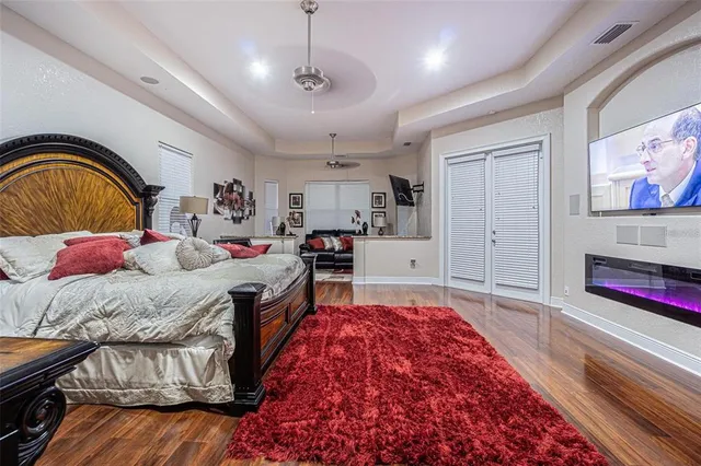 a bed room with a bed and a television