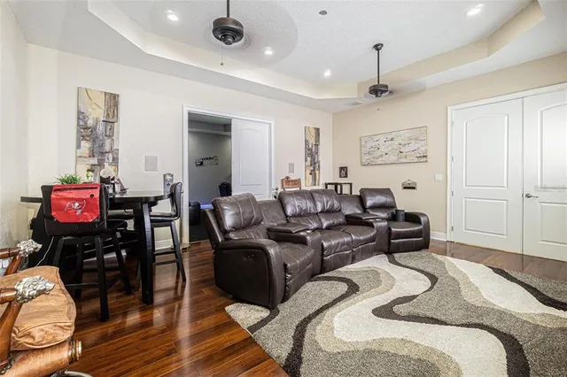 a bedroom with furniture and wooden floor