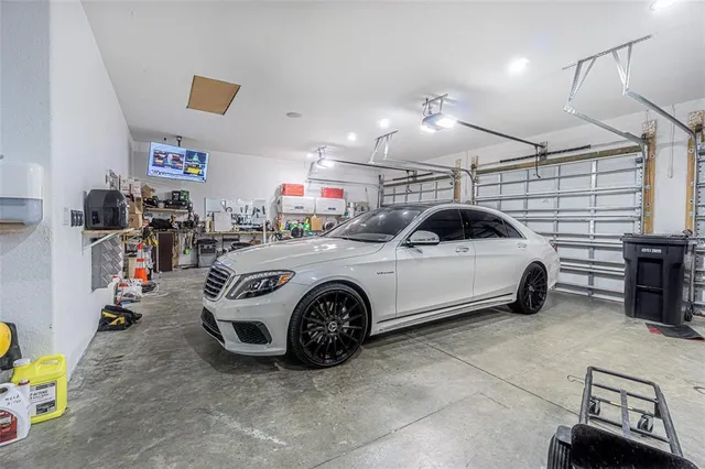 a kitchen with a granite countertop sink a counter and cabinets