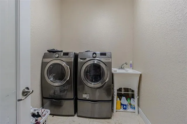 a bathroom with a granite countertop sink a mirror and a bathtub