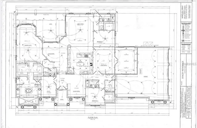 a aerial view of a house with a yard table and chairs