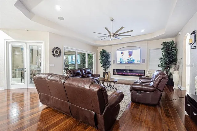 a living room with furniture and a large window