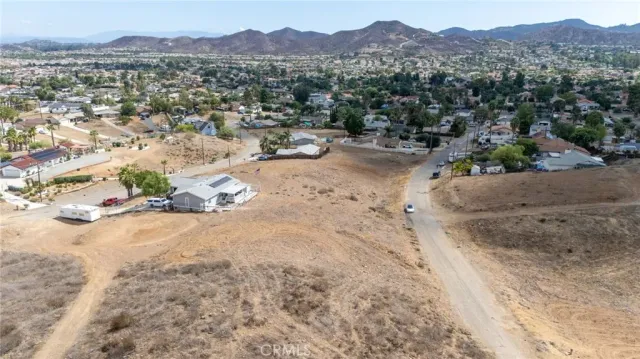 a view of a town with mountains in the background