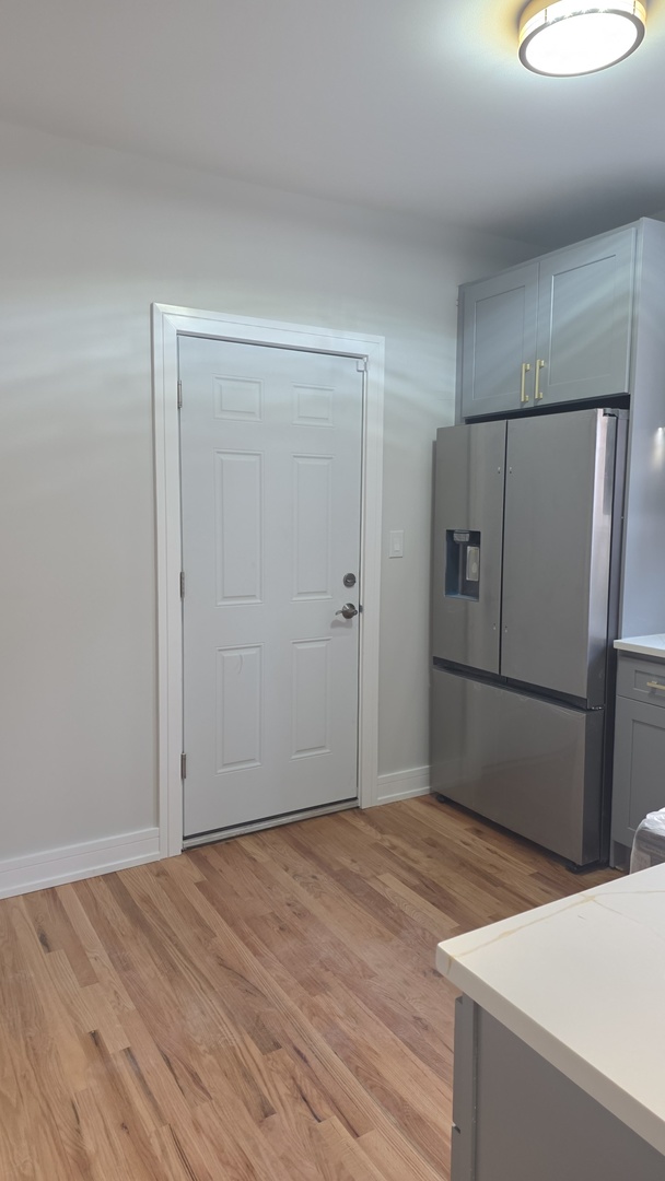 7607 South Evans Avenue Chicago, IL 60619 - Photo 5 of 15 a view of an empty room with closet and a window