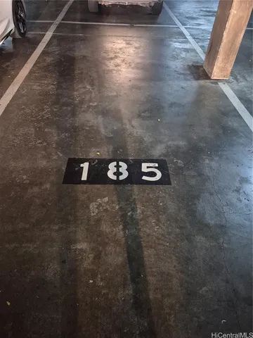 a view of water heater room with wooden floor