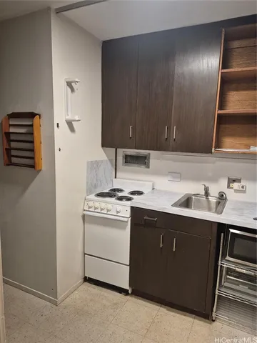 a view of a refrigerator with wooden floor