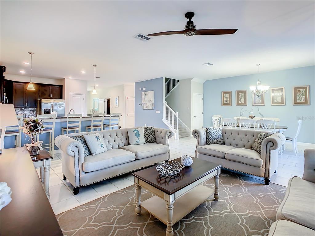 1305 Divot Way Davenport, FL 33896 - Photo 16 of 19 a living room with furniture and a ceiling fan