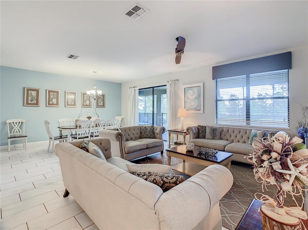 1305 Divot Way Davenport, FL 33896 - Photo 17 of 19 a living room with furniture and a large window