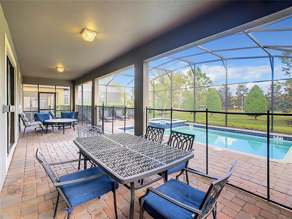 1305 Divot Way Davenport, FL 33896 - Photo 4 of 19 a view of a dining room with furniture window and outside view