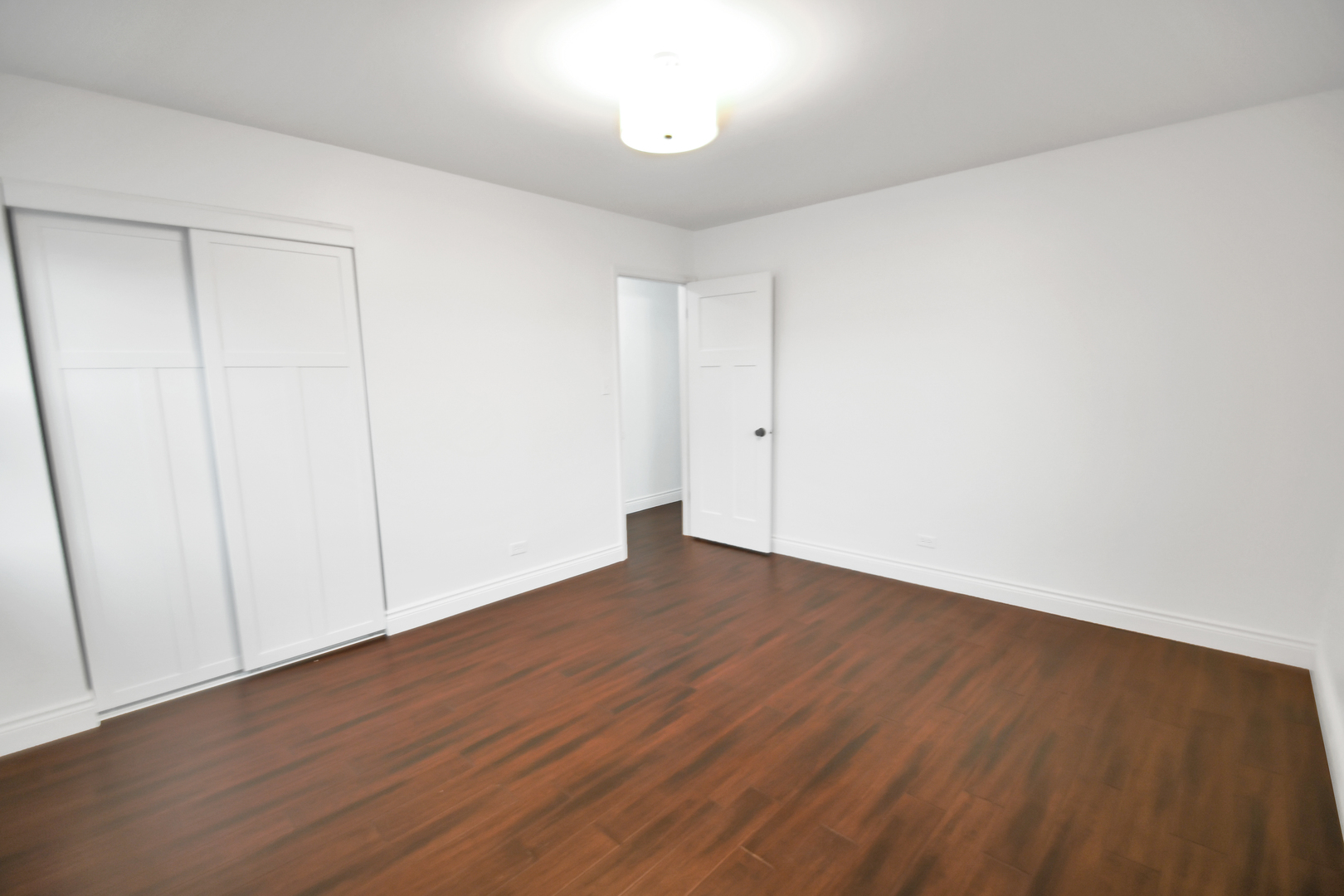 809 Cove Avenue Lockport, IL 60441 - Photo 15 of 22 a view of an empty room with wooden floor