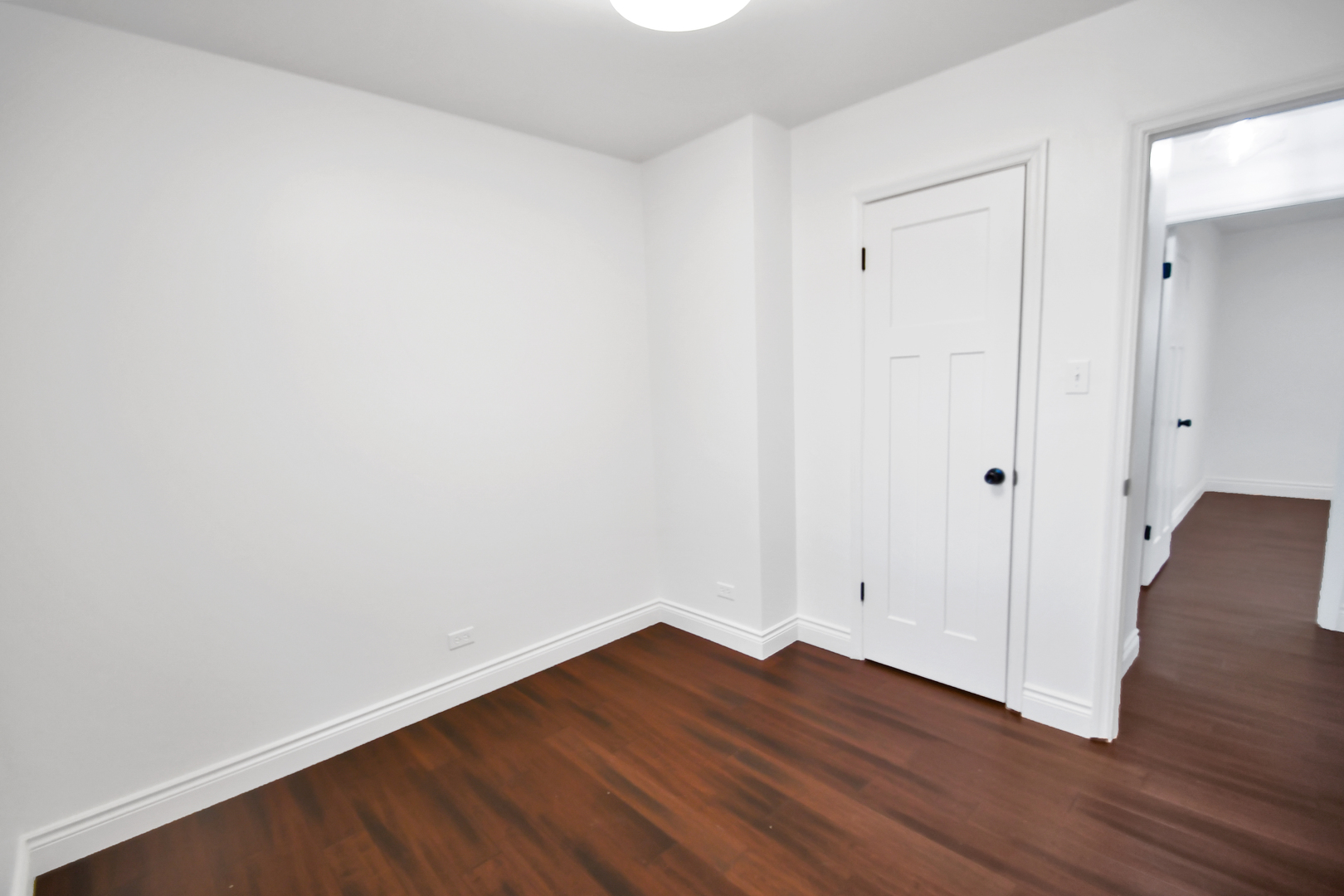 809 Cove Avenue Lockport, IL 60441 - Photo 20 of 22 a view of an empty room with wooden floor