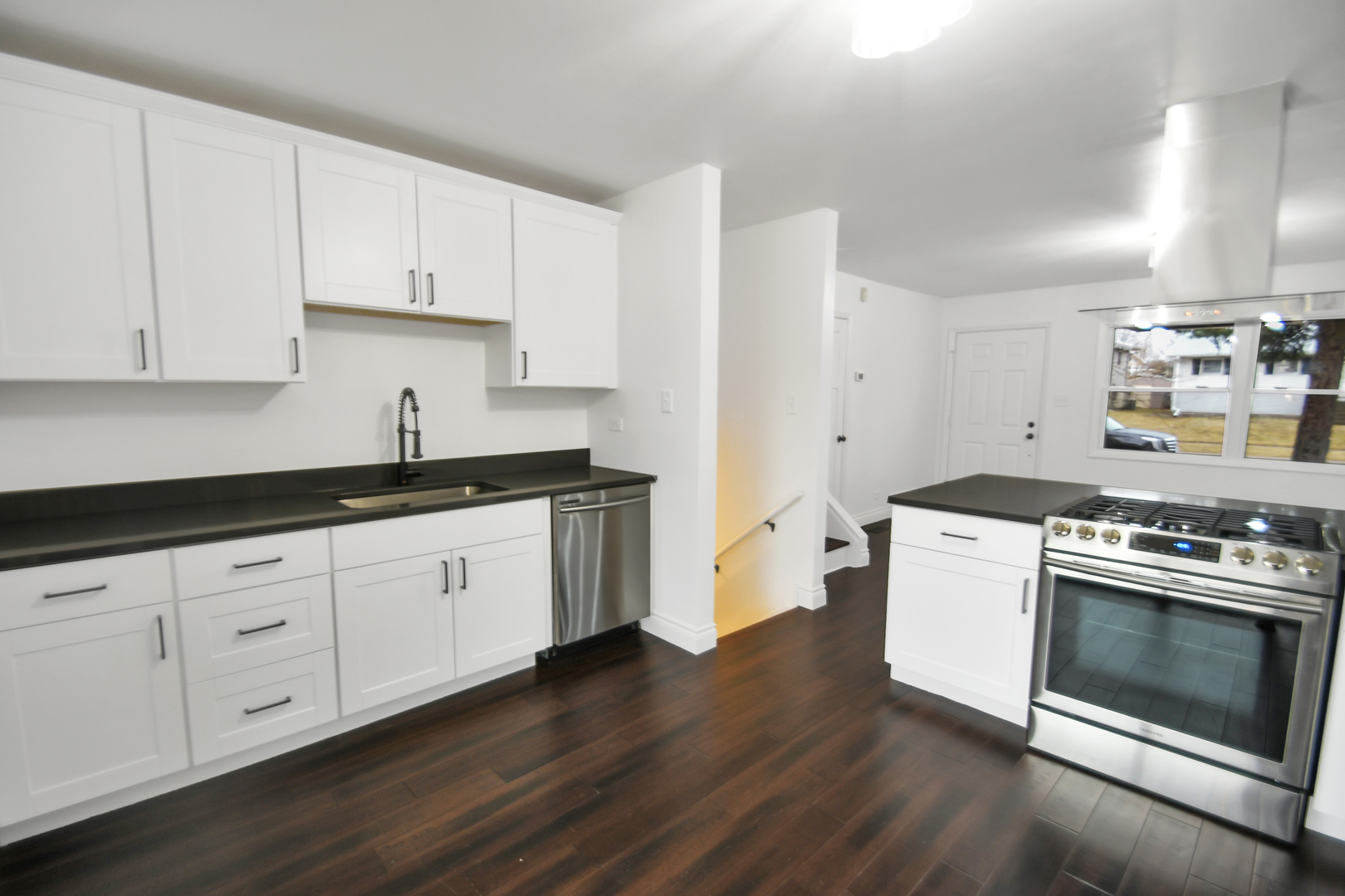 809 Cove Avenue Lockport, IL 60441 - Photo 7 of 22 a kitchen with granite countertop white cabinets and white appliances