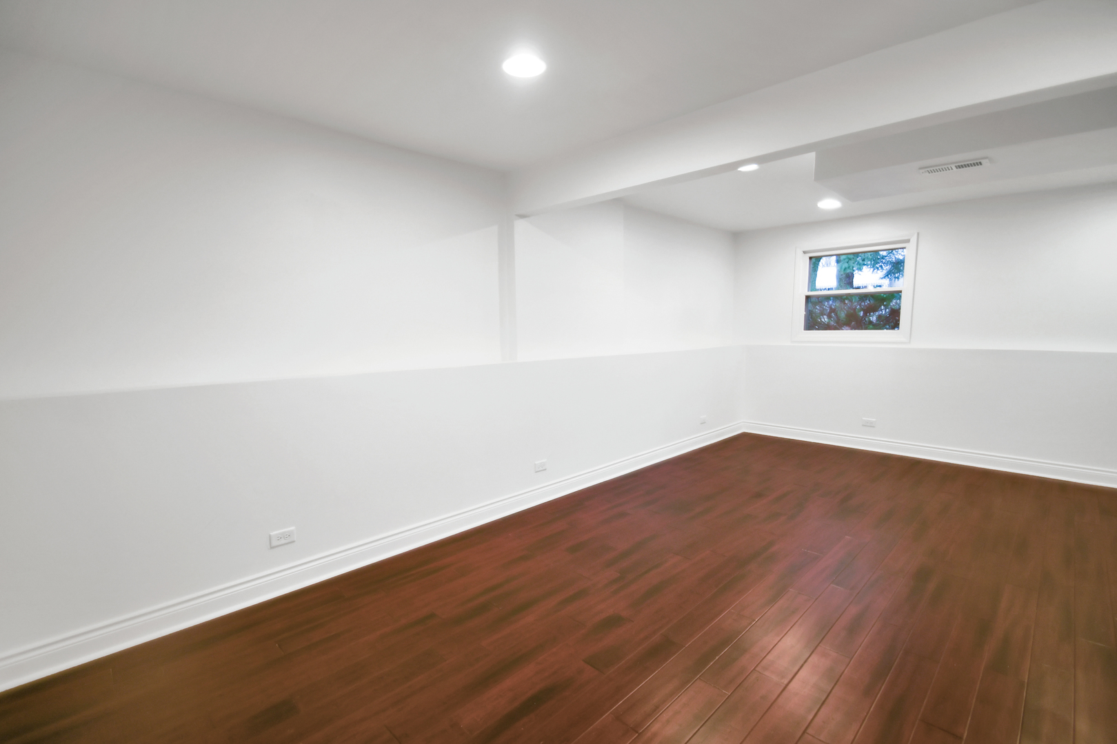 809 Cove Avenue Lockport, IL 60441 - Photo 9 of 22 an empty room with wooden floor and windows
