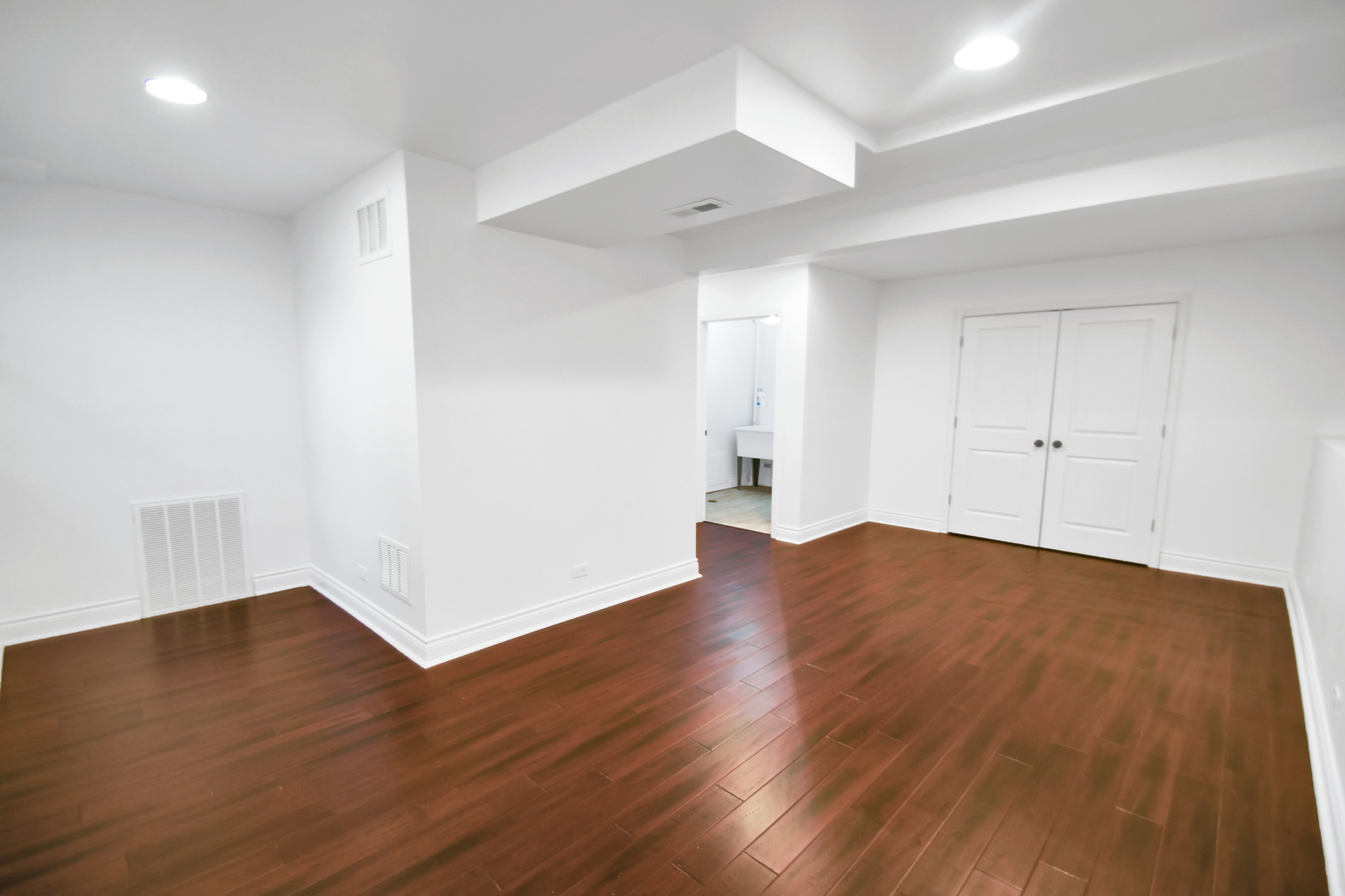 809 Cove Avenue Lockport, IL 60441 - Photo 10 of 22 a view of an empty room with wooden floor
