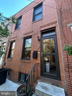 a front view of a house with a porch