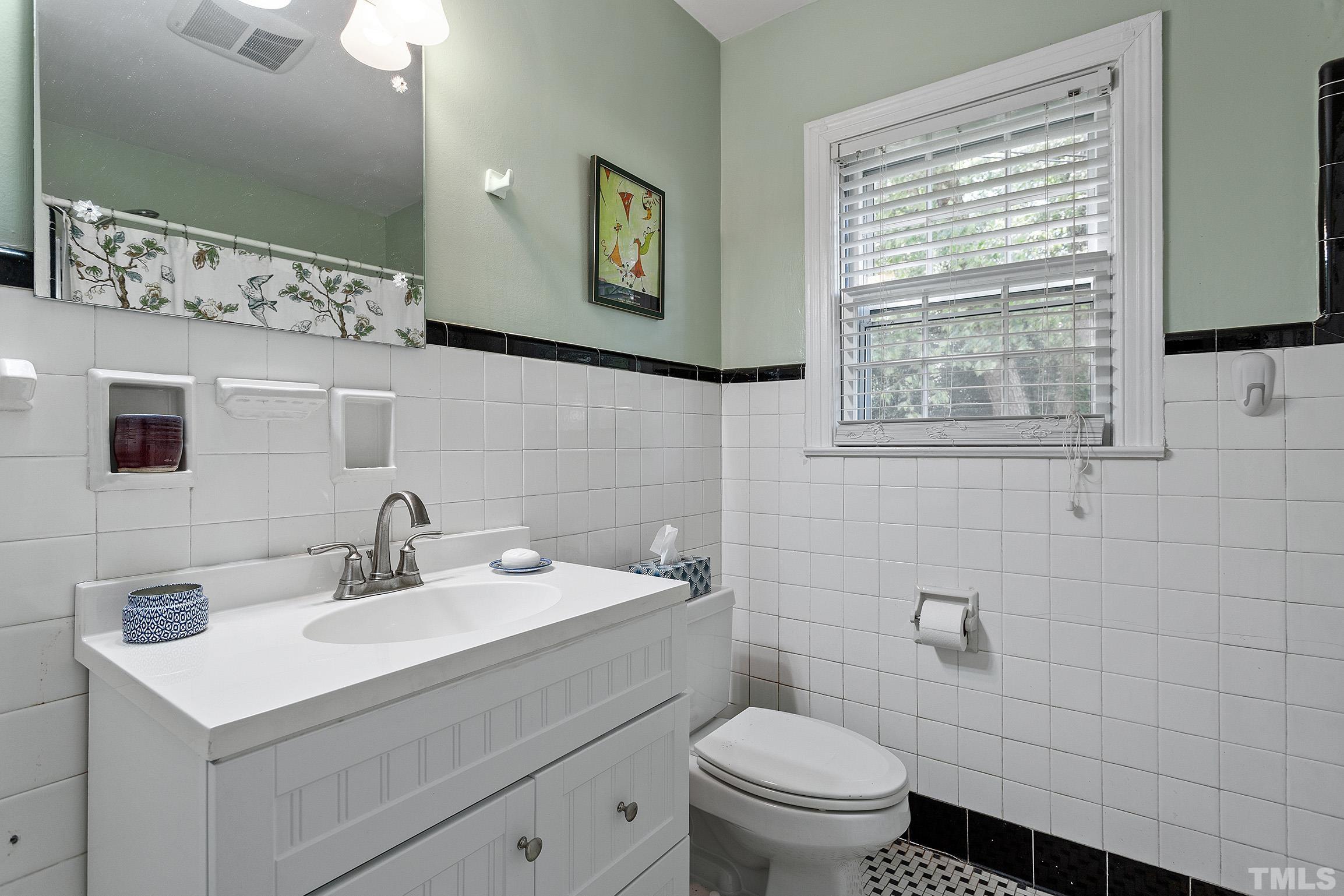 121 Lake Boone Trail Raleigh, NC 27608 - Photo 16 of 29 a bathroom with a sink toilet and mirror