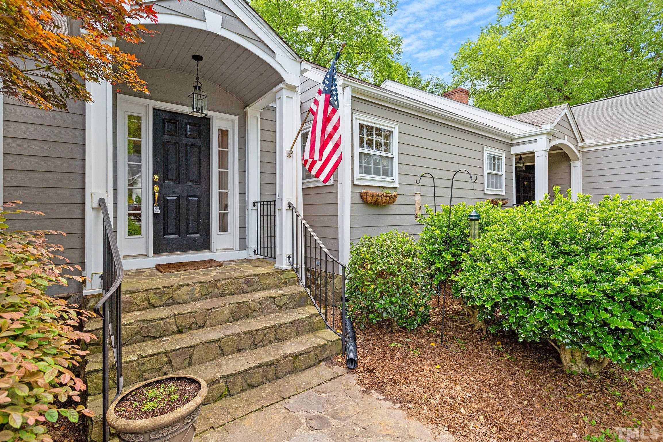 121 Lake Boone Trail Raleigh, NC 27608 - Photo 4 of 29 a front view of a house with a garden