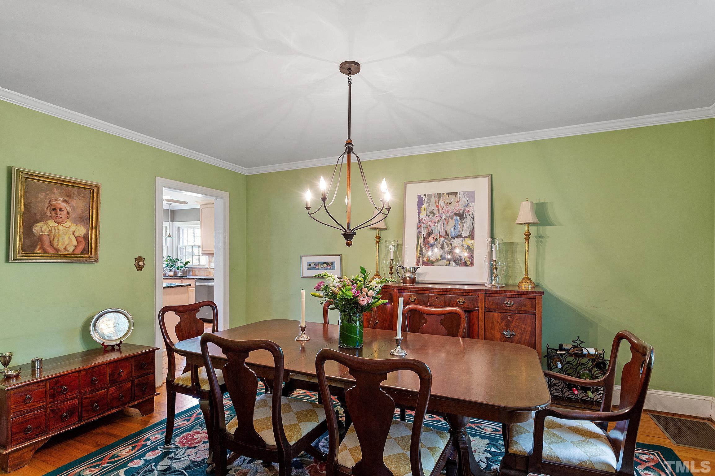 121 Lake Boone Trail Raleigh, NC 27608 - Photo 9 of 29 a view of a dining room with furniture and chandelier