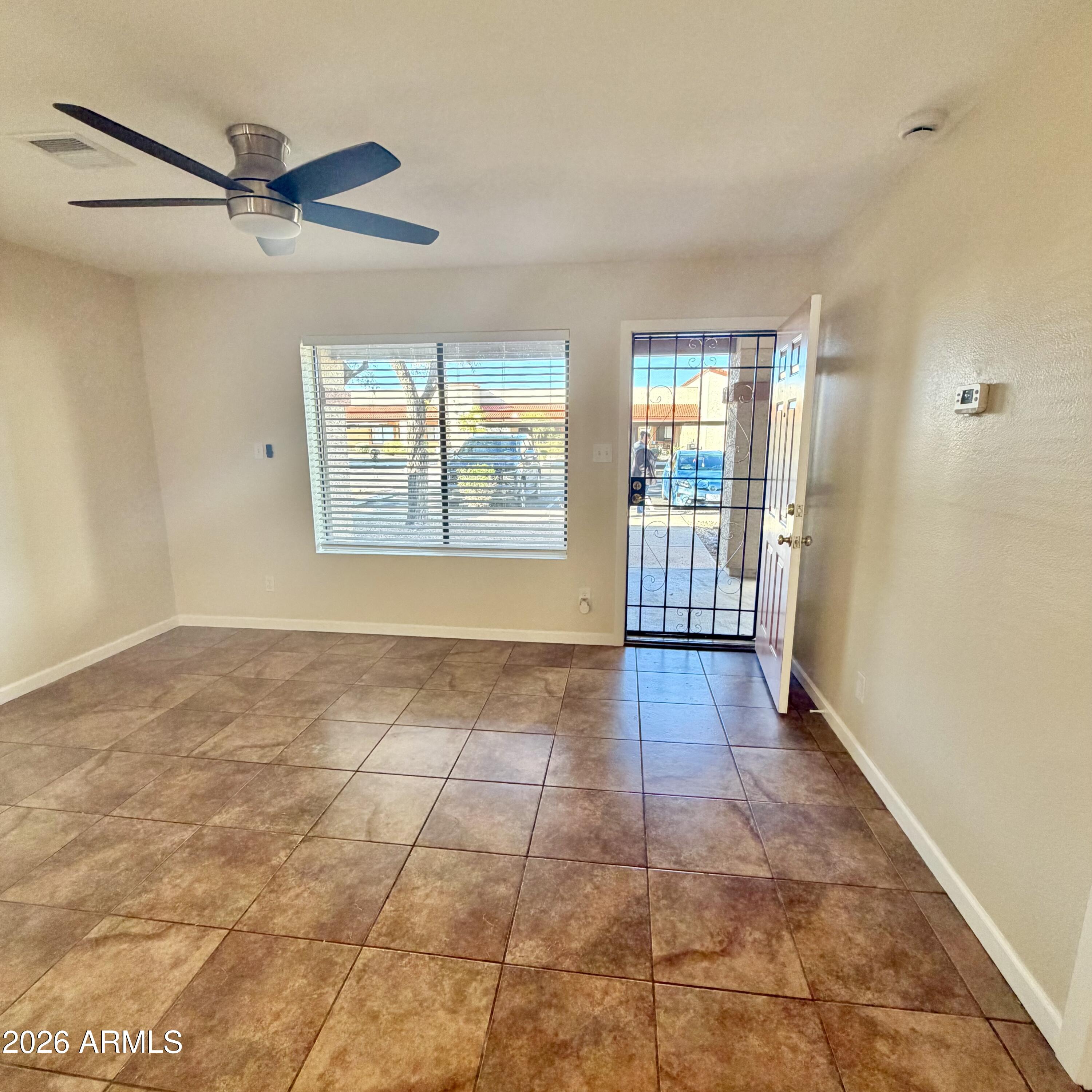 1440 North Idaho Road, Unit 1024 Apache Junction, AZ 85119 - Photo 3 of 9 a view of an empty room with a window