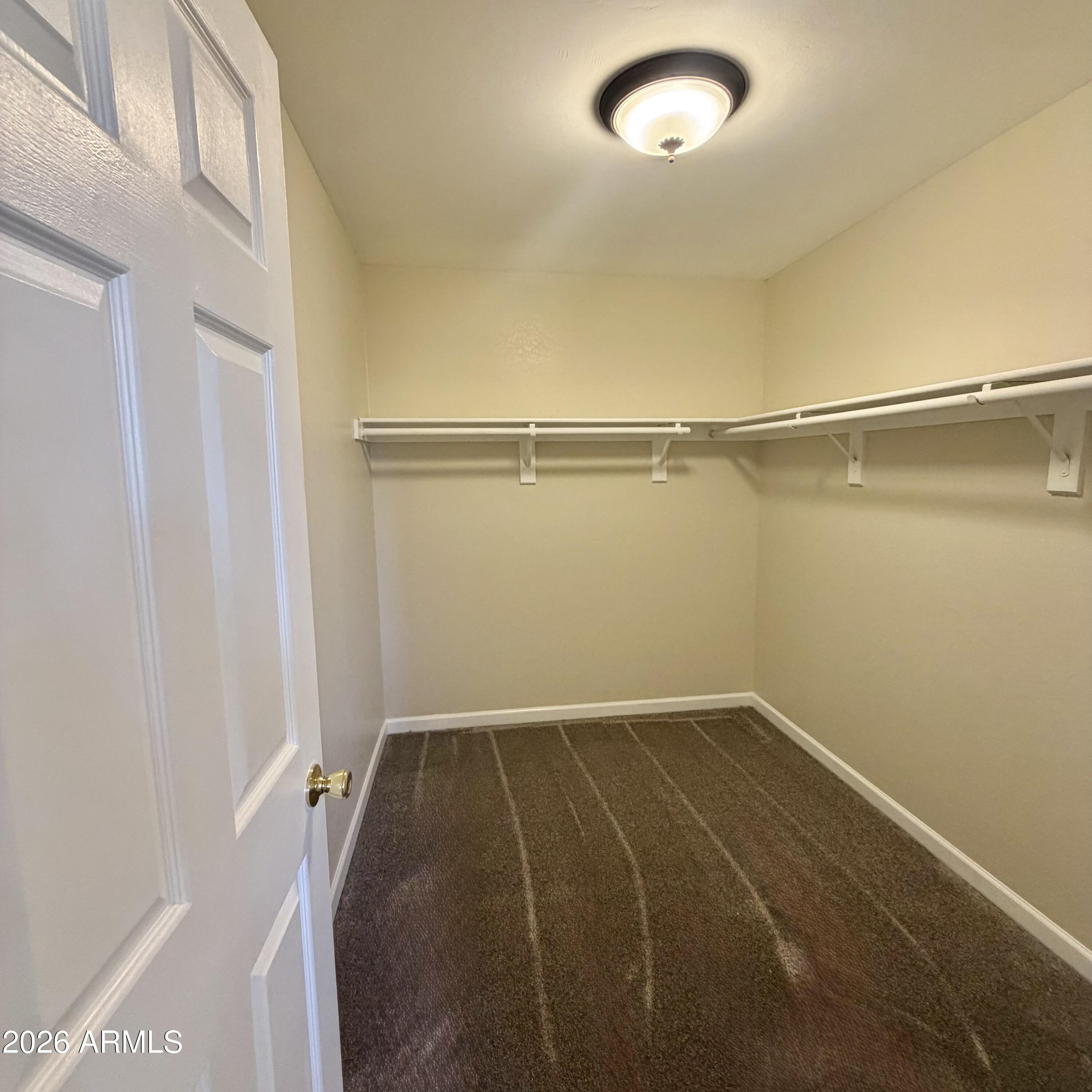1440 North Idaho Road, Unit 1024 Apache Junction, AZ 85119 - Photo 6 of 9 a view of a room with empty racks
