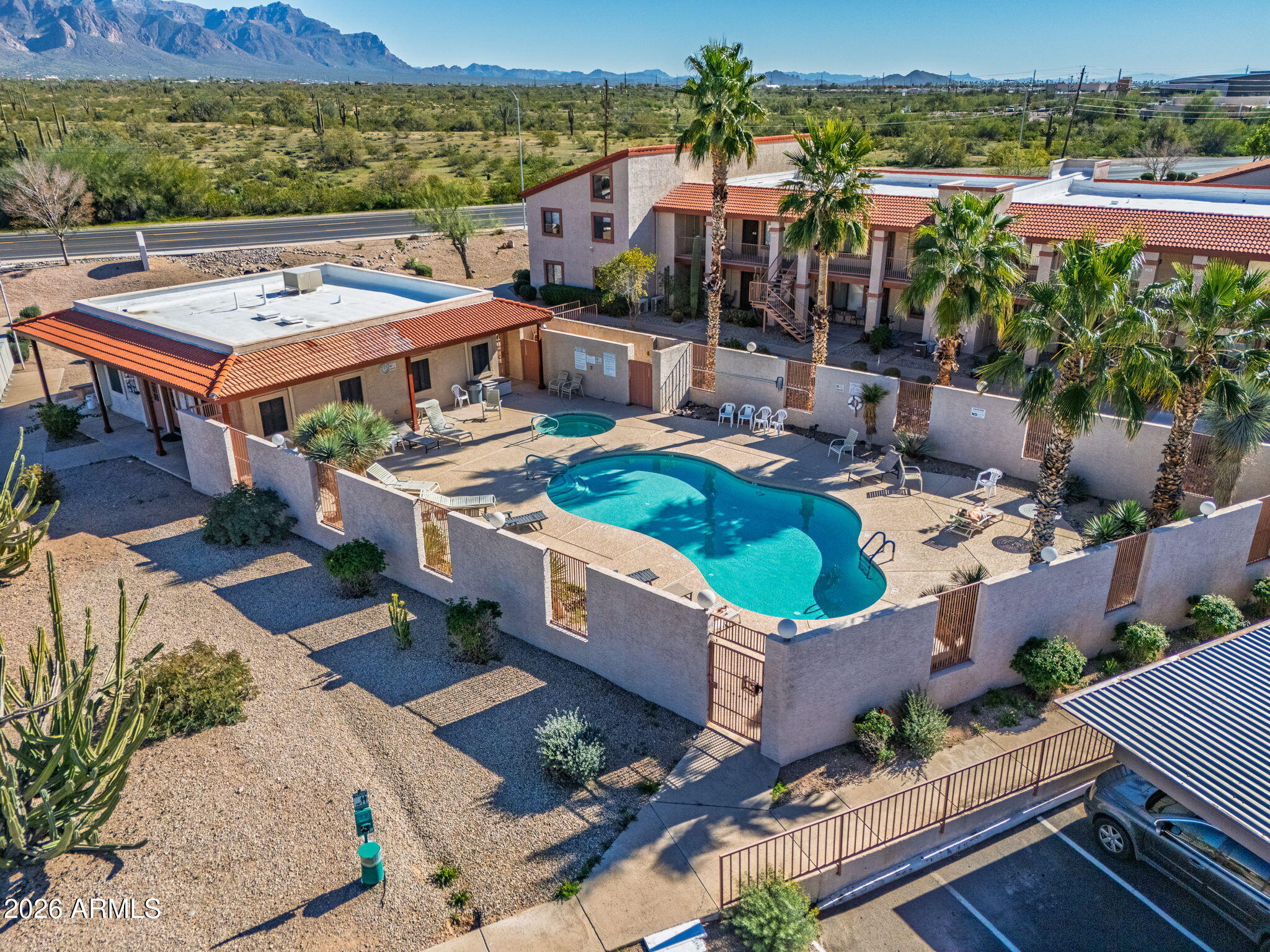 1440 North Idaho Road, Unit 1024 Apache Junction, AZ 85119 - Photo 9 of 9 an aerial view of a house with a big yard