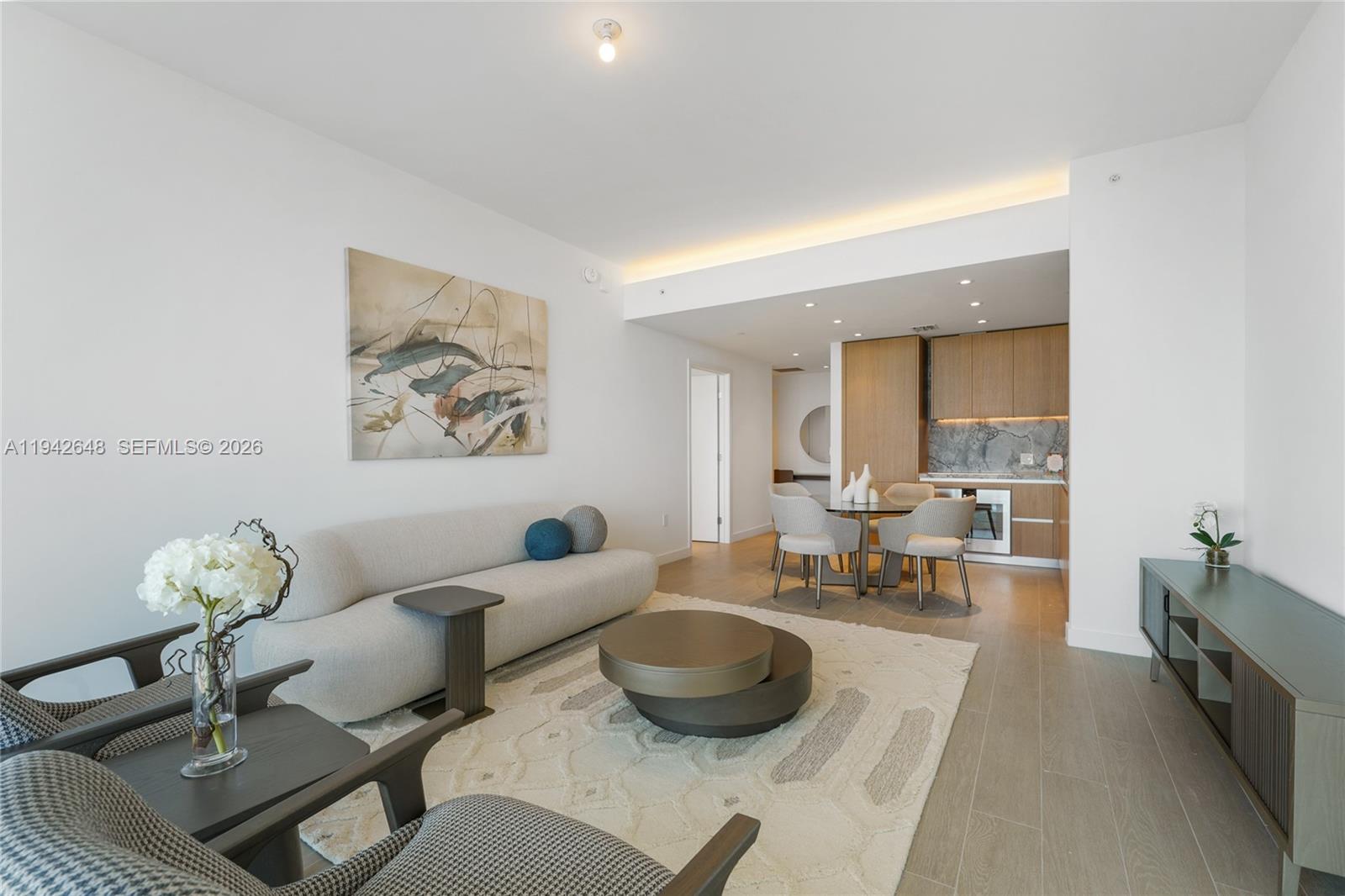 500 Alton Road, Unit 1506 Miami Beach, FL 33139 - Photo 4 of 21 a living room with furniture and a potted plant