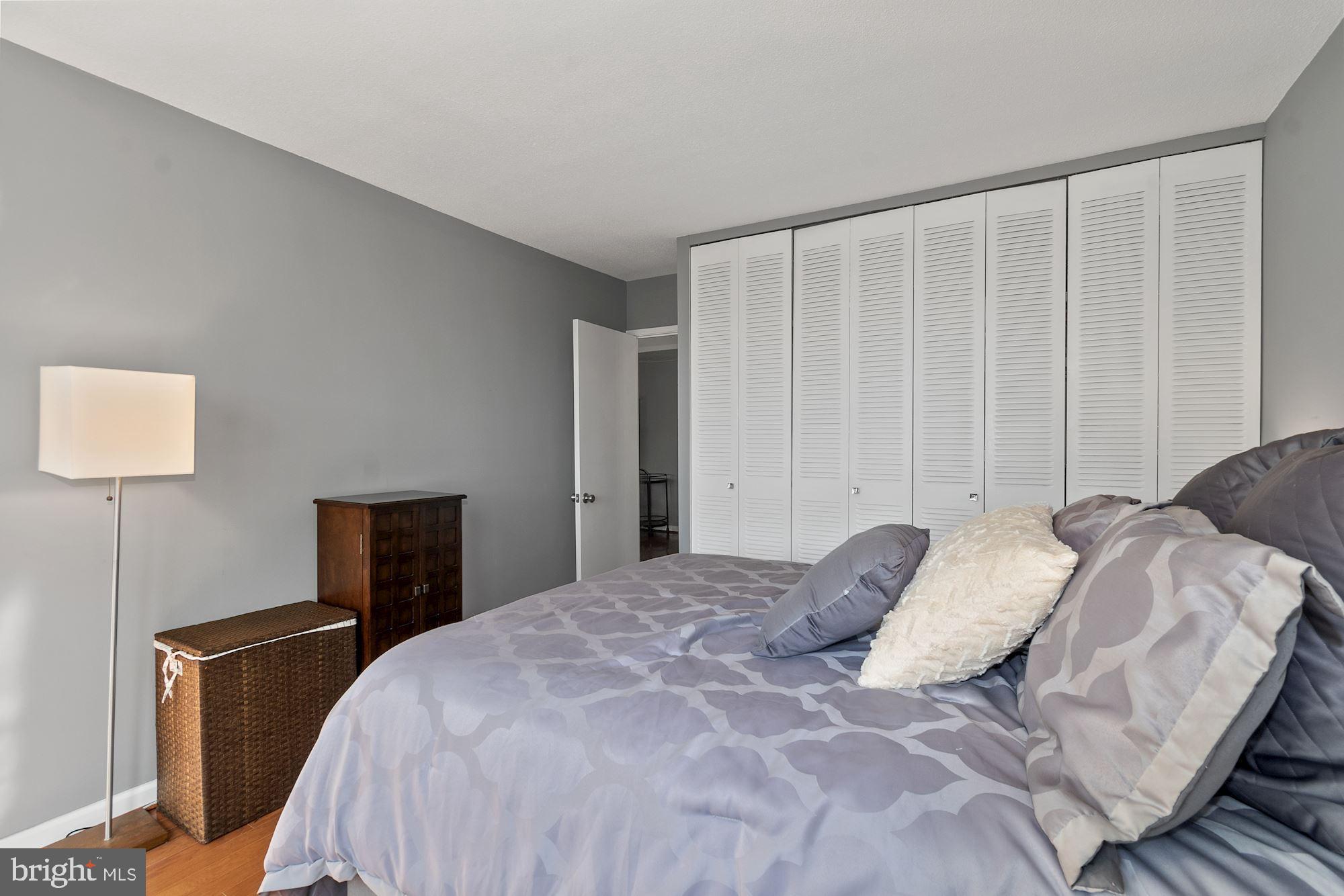 1311 Delaware Avenue Southwest, Unit S346 Washington, DC 20024 - Photo 12 of 27 a bedroom with a bed and a window