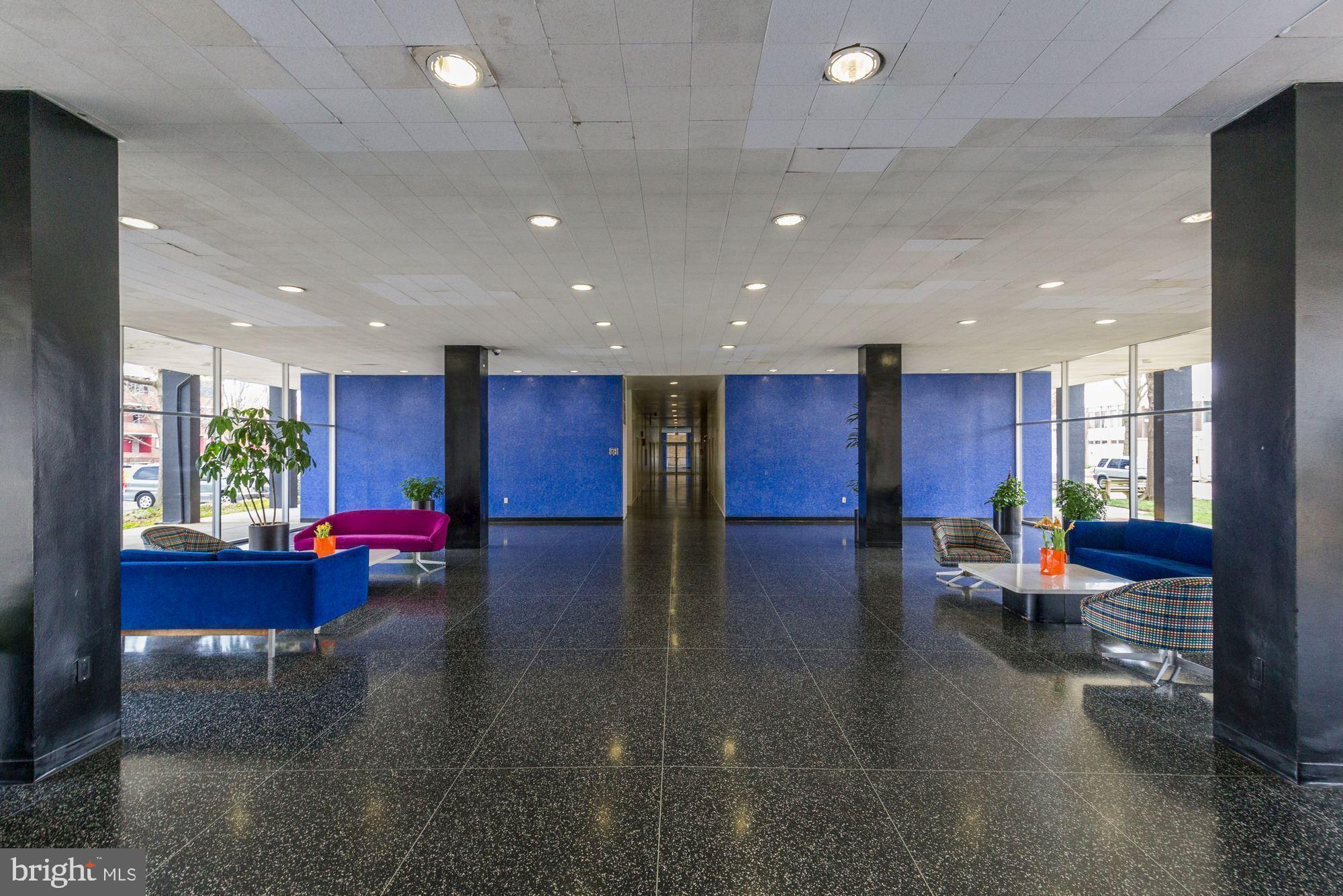 1311 Delaware Avenue Southwest, Unit S346 Washington, DC 20024 - Photo 18 of 27 a lobby with furniture and stairs