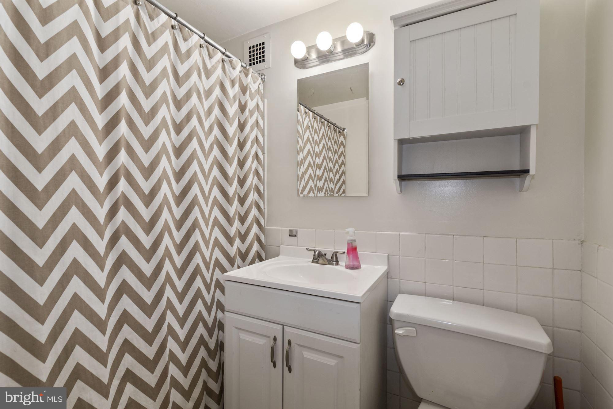1311 Delaware Avenue Southwest, Unit S346 Washington, DC 20024 - Photo 10 of 27 a bathroom with a toilet and a sink