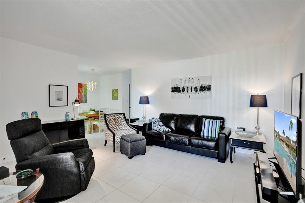 17001 Northeast 13th Avenue, Unit 104 Miami, FL 33162 - Photo 2 of 41 a living room with furniture