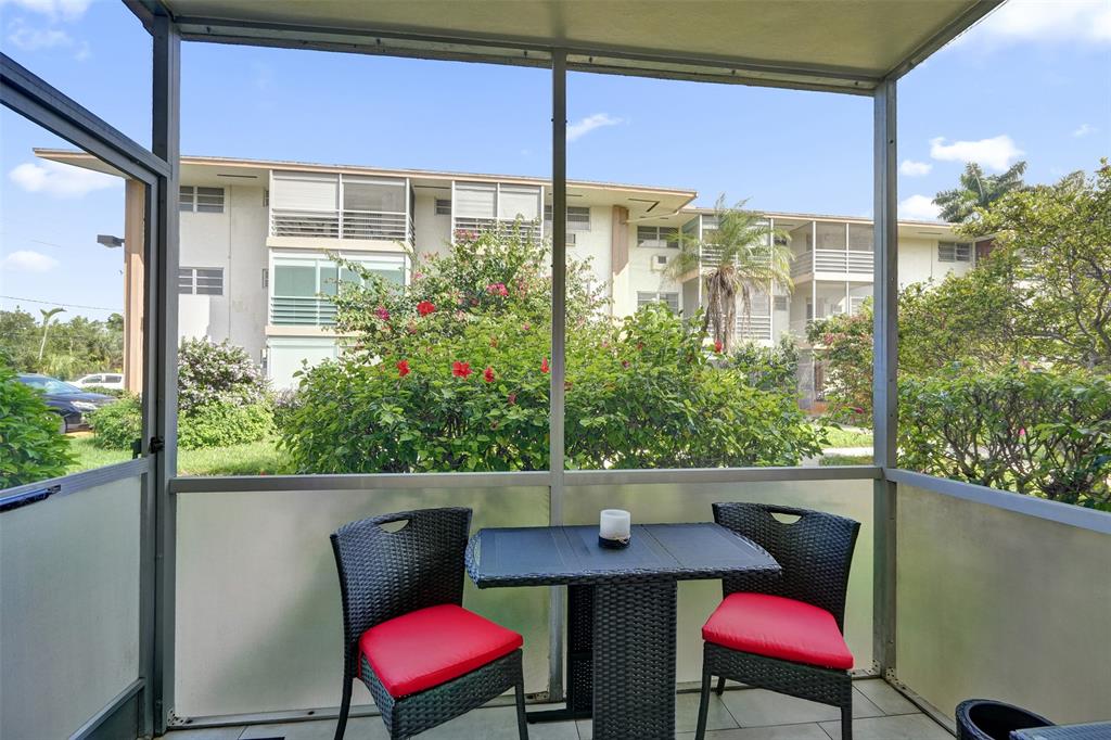 17001 Northeast 13th Avenue, Unit 104 Miami, FL 33162 - Photo 21 of 41 a view of a outdoor seating area