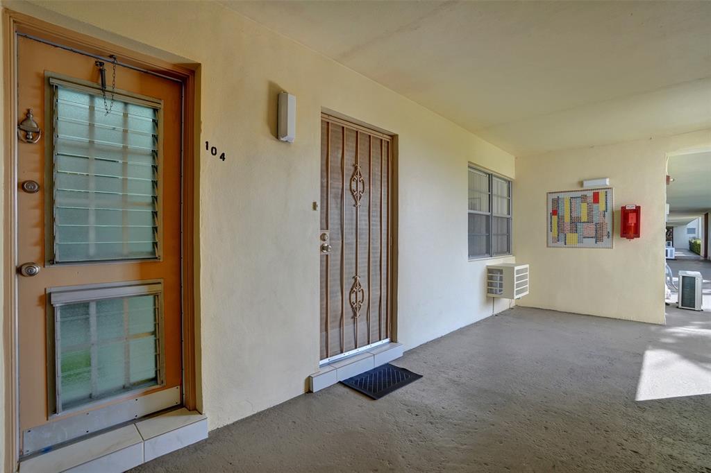 17001 Northeast 13th Avenue, Unit 104 Miami, FL 33162 - Photo 30 of 41 a view of an empty room with closet and a window