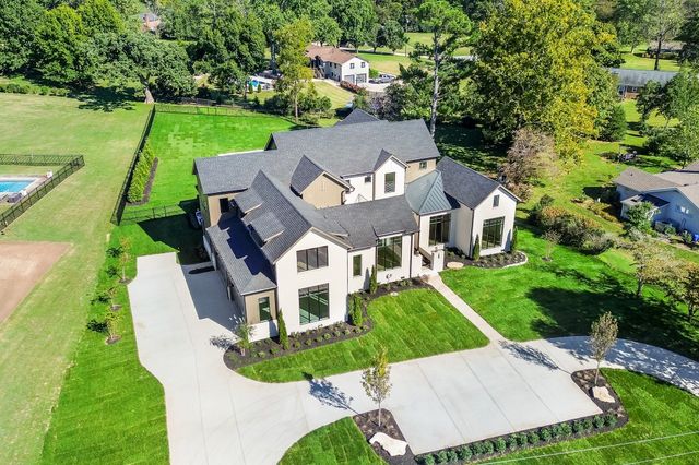an aerial view of a house with a garden
