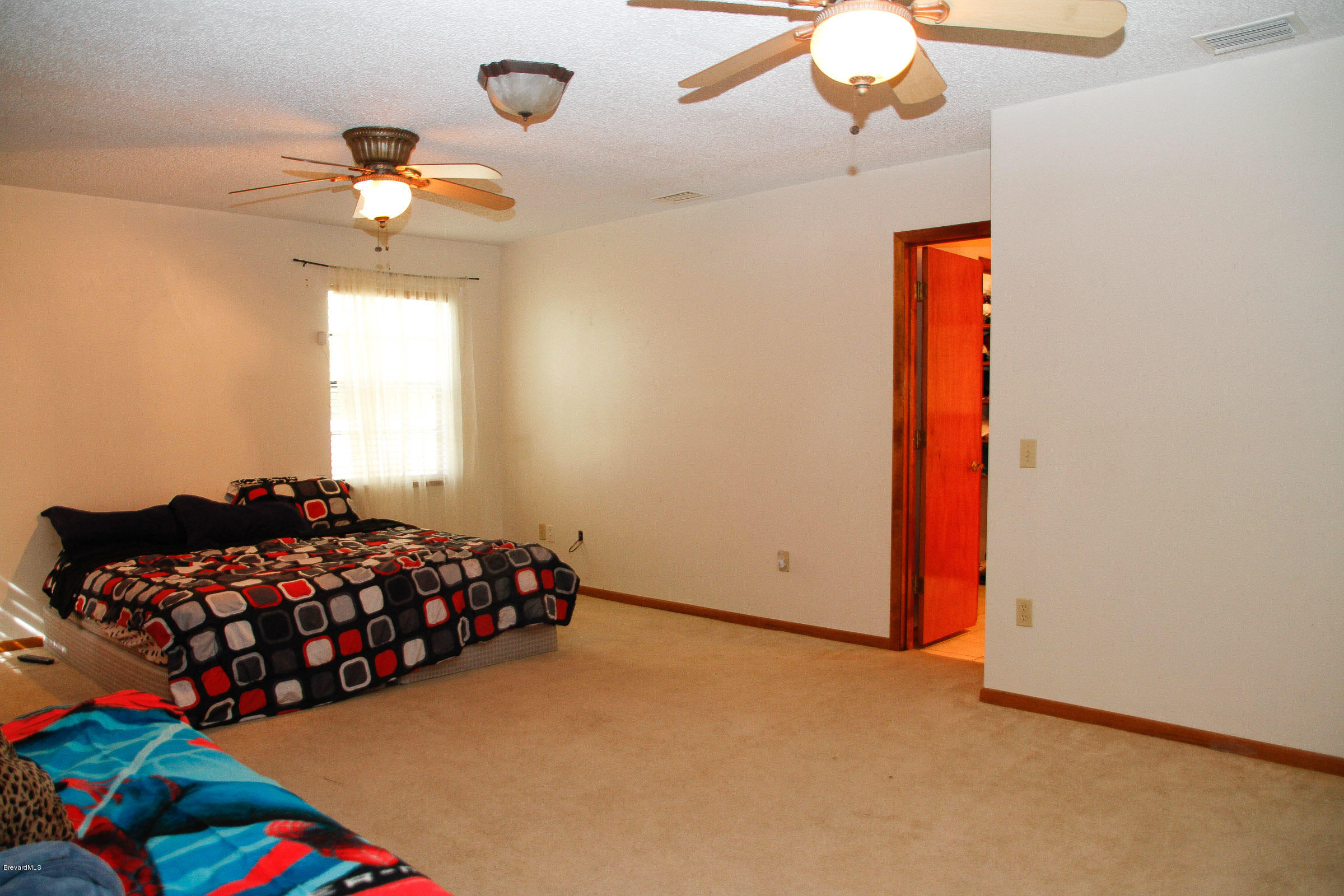 410 South Carpenter Road Titusville, FL 32796 - Photo 18 of 27 Master Bedroom