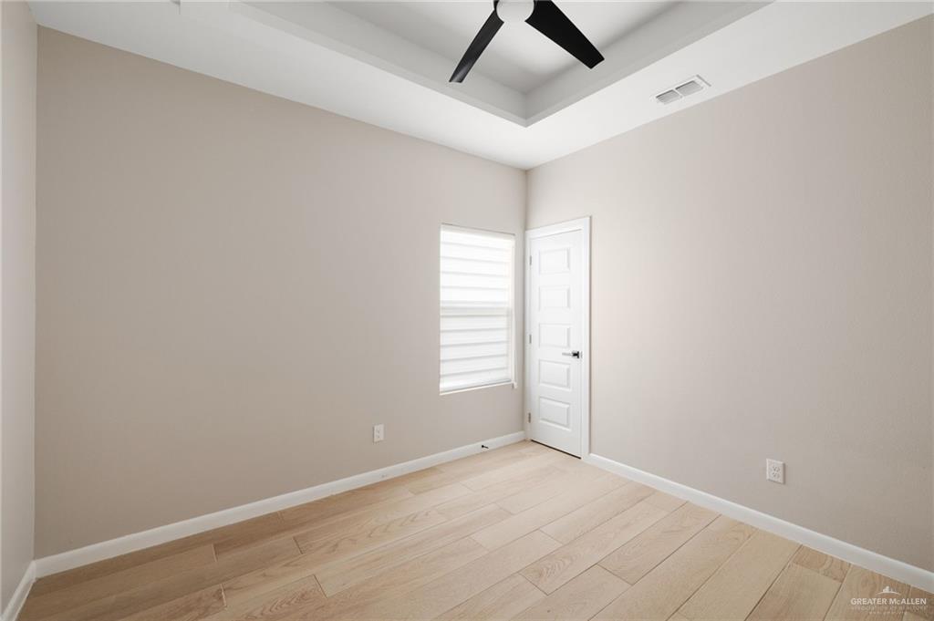 5812 Northwestern Avenue, Unit 3 Mission, TX 78573 - Photo 8 of 10 an empty room with windows and closet