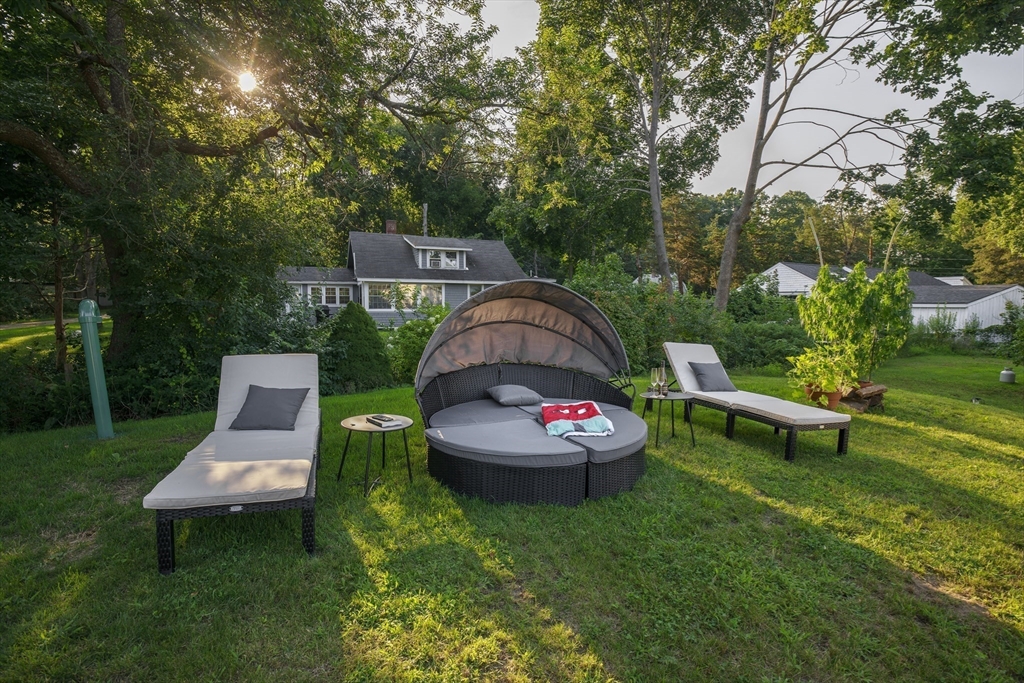 70 Cottage Road Newbury, MA 01951 - Photo 20 of 25 a view of a chairs and table in backyard of the house