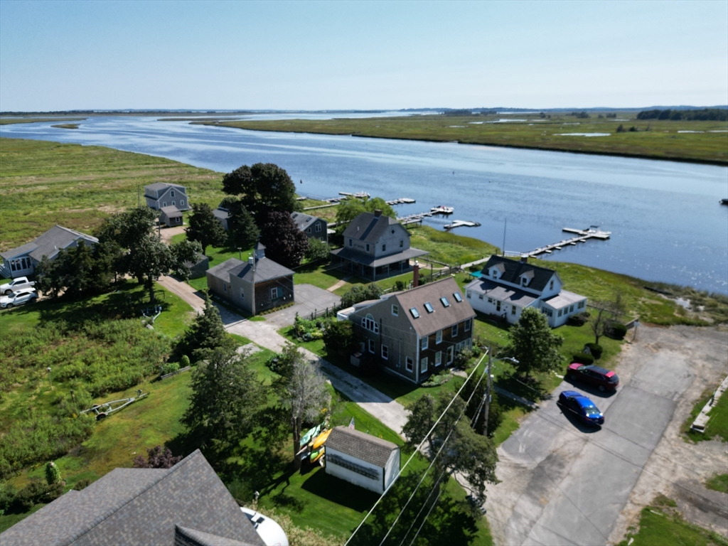 70 Cottage Road Newbury, MA 01951 - Photo 3 of 25 an aerial view of ocean with residential house and outdoor space