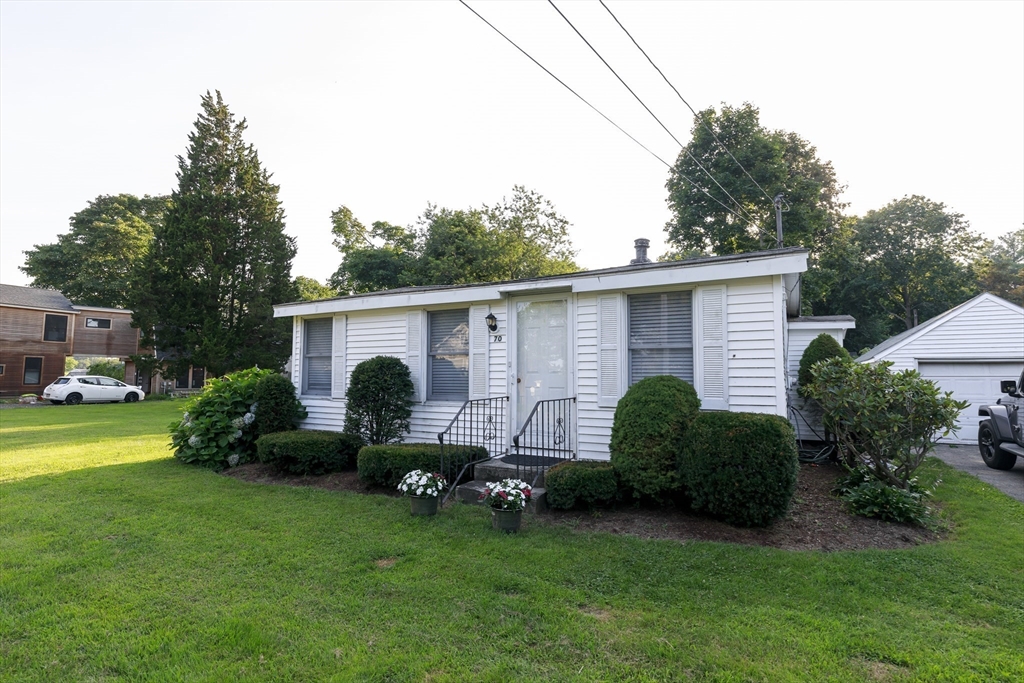 70 Cottage Road Newbury, MA 01951 - Photo 5 of 25 a view of a house with backyard sitting area and garden