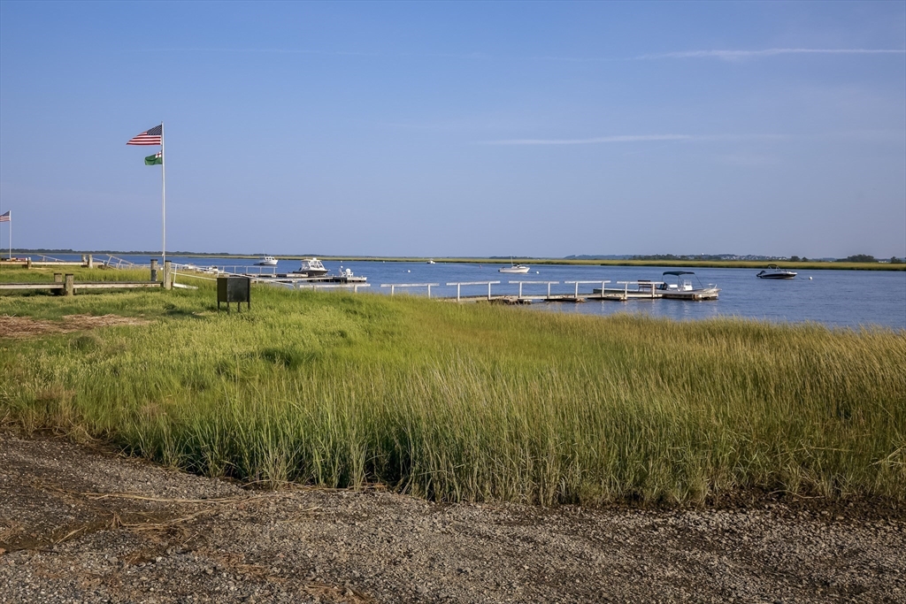 70 Cottage Road Newbury, MA 01951 - Photo 6 of 25 a view of a water with a big yard