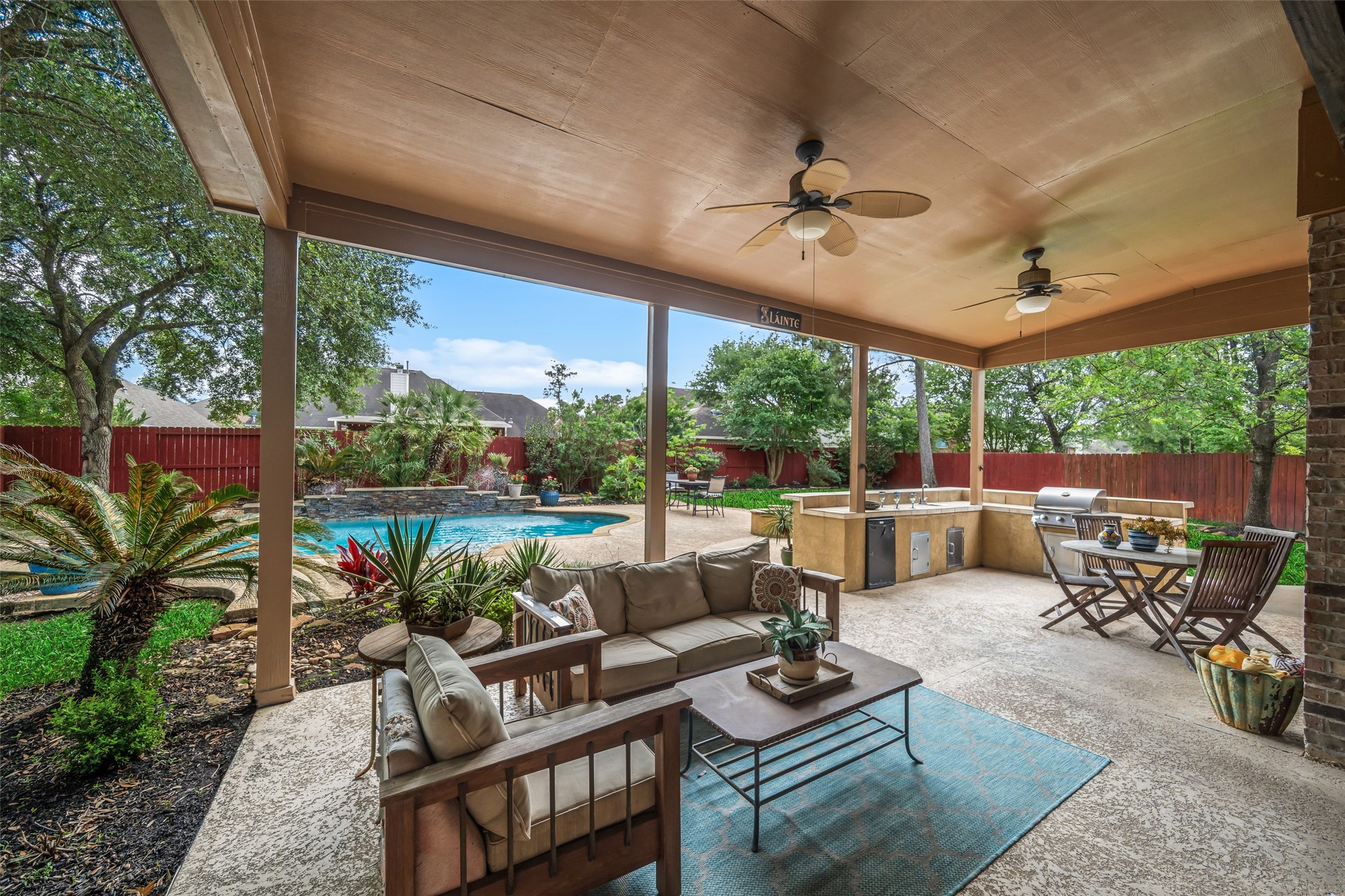 6407 Ashley Manor Drive Spring, TX 77389 - Photo 33 of 41 a living room with patio furniture and a potted plants