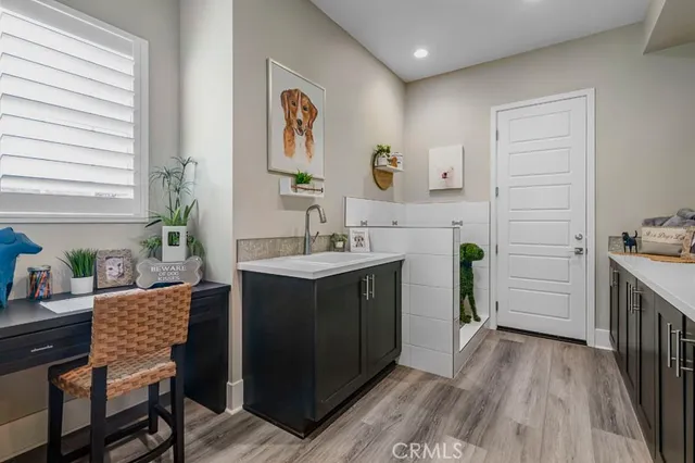 a spacious bathroom with a sink a mirror and a shower