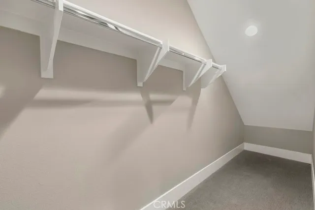 a view of an empty walk in closet