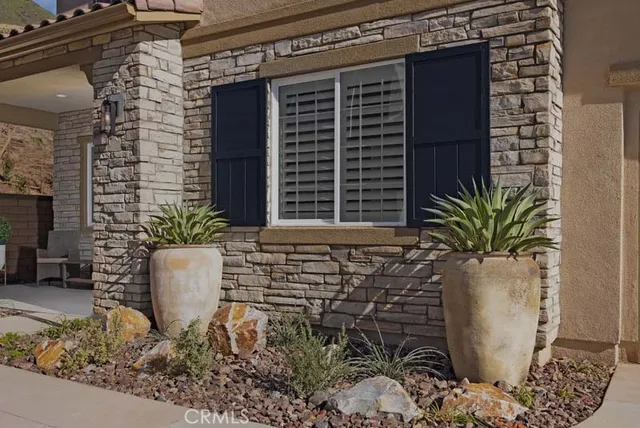 a view of house with potted plant