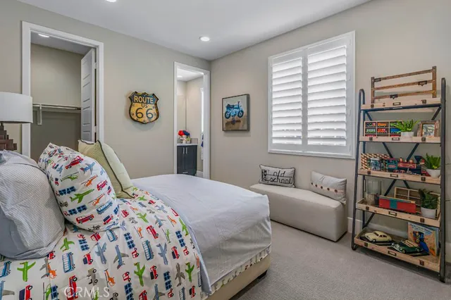 a bedroom with bed and a window