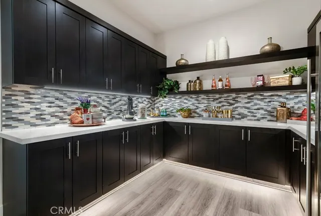 a kitchen with stainless steel appliances wooden cabinets and a sink