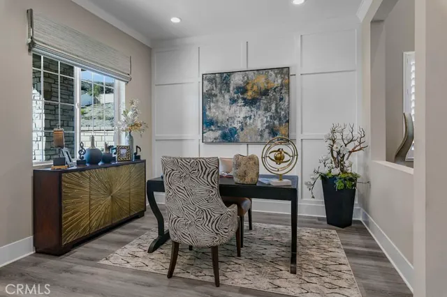 a view of a dinning room with furniture window and wooden floor