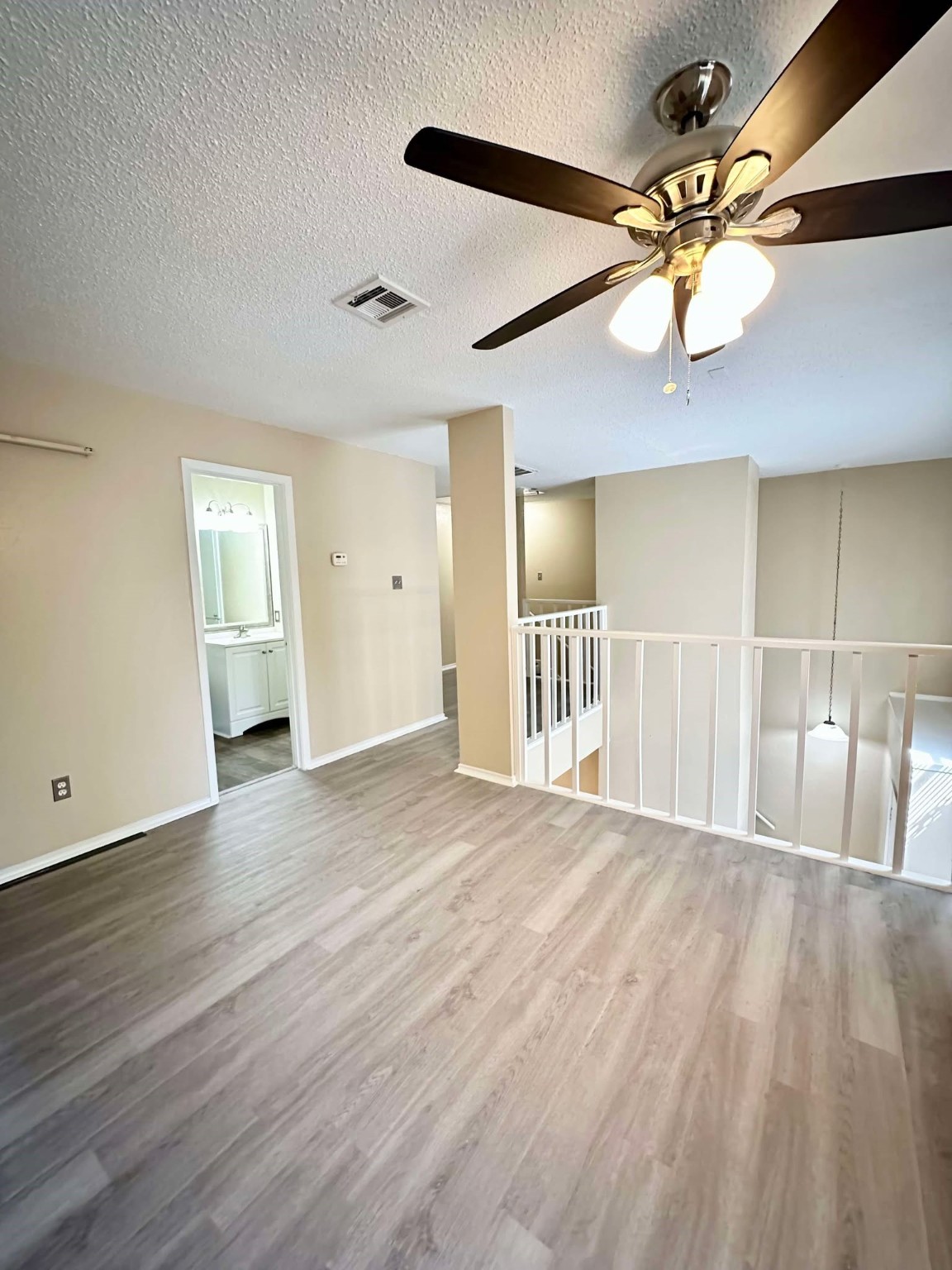 3630 Ocee Street Houston, TX 77063 - Photo 11 of 21 a view of a livingroom with a ceiling fan and wooden floor