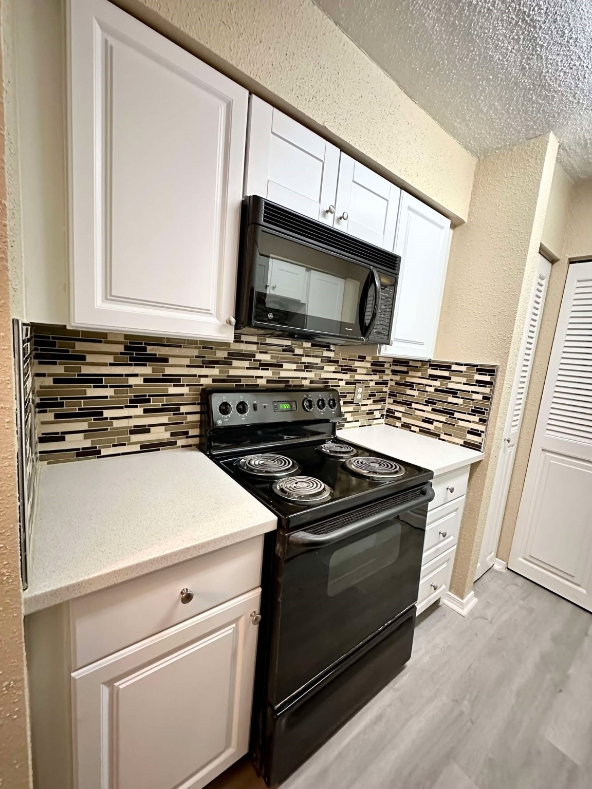 3630 Ocee Street Houston, TX 77063 - Photo 5 of 21 a kitchen with a stove and a microwave