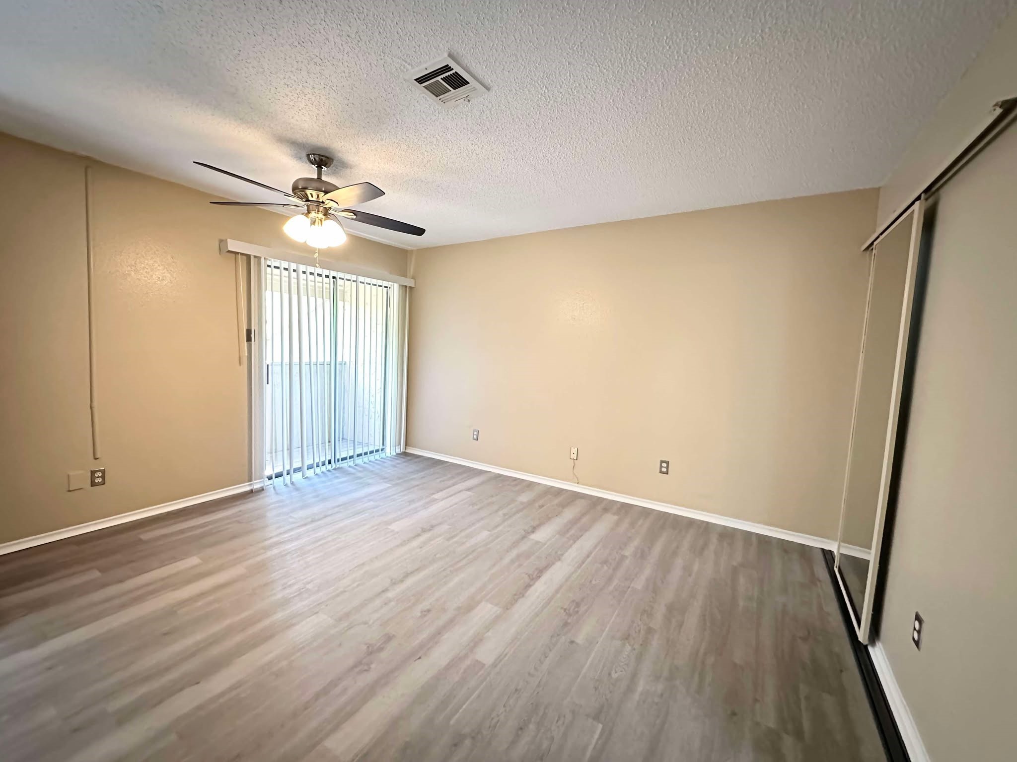 3630 Ocee Street Houston, TX 77063 - Photo 10 of 21 wooden floor in an empty room with a window